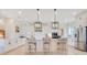 Bright kitchen featuring a large island with pendant lighting and modern stainless steel appliances at 13791 Abberwick Dr, Orlando, FL 32832