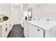 Well-appointed laundry room with modern washer and dryer, sink, and ample storage space at 13791 Abberwick Dr, Orlando, FL 32832
