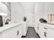 Bright laundry room with white cabinets, modern appliances, and stylish black hexagon tile flooring at 13791 Abberwick Dr, Orlando, FL 32832