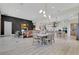 Open-concept living room with a dining area and a modern kitchen in the background at 13791 Abberwick Dr, Orlando, FL 32832