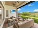 Relaxing outdoor patio with comfortable seating and an outdoor television for entertaining at 13791 Abberwick Dr, Orlando, FL 32832