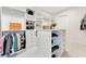 Well-organized walk-in closet with custom shelving, drawers, and hanging rods at 13791 Abberwick Dr, Orlando, FL 32832