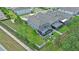 An aerial view of a gray home featuring a screened-in patio in a well-maintained community at 1425 Paget Cv, Sanford, FL 32771