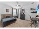 Bedroom featuring neutral colored carpet, artwork, a ceiling fan, and a desk at 1425 Paget Cv, Sanford, FL 32771