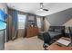 Bedroom featuring a dark color palette, large TV, ceiling fan, and natural light at 1425 Paget Cv, Sanford, FL 32771