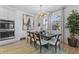 Dining room features modern chandelier, large windows, and a dining table that seats six at 1425 Paget Cv, Sanford, FL 32771