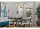 The dining area features a modern chandelier and a large window at 1425 Paget Cv, Sanford, FL 32771