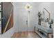 The entryway is a modern chandelier and stylish console table at 1425 Paget Cv, Sanford, FL 32771