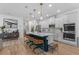 Kitchen boasts a large island, modern appliances, and stylish pendant lighting at 1425 Paget Cv, Sanford, FL 32771