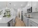 A spacious kitchen with a large island, stainless steel appliances, and stylish pendant lighting at 1425 Paget Cv, Sanford, FL 32771