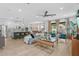 Open-concept living space features a modern kitchen with an island and a spacious living area with stylish decor at 1425 Paget Cv, Sanford, FL 32771