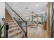 Open-concept layout connecting the staircase to living, dining, and kitchen areas, offering a spacious feel at 1425 Paget Cv, Sanford, FL 32771