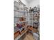 Walk-in pantry with wire shelving, offering ample storage for food and kitchen essentials at 1425 Paget Cv, Sanford, FL 32771