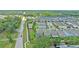 A street view of a gray home in a well-maintained community with trees and landscaping at 1425 Paget Cv, Sanford, FL 32771