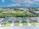 Aerial view of a neighborhood with attractive homes with lush landscaping, and manicured lawns at 14325 Hidden Ct, Clermont, FL 34711