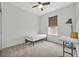 Simple bedroom with carpet, good natural light, and compact desk-workspace area at 14325 Hidden Ct, Clermont, FL 34711