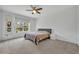 Neutral Primary bedroom featuring a ceiling fan, window with view, and a calm, relaxing atmosphere at 14325 Hidden Ct, Clermont, FL 34711