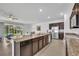 Spacious kitchen with an island, stainless steel appliances, and a view of the backyard at 14325 Hidden Ct, Clermont, FL 34711