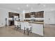 Stylish kitchen boasts granite countertops, stainless steel appliances, and a breakfast bar at 14325 Hidden Ct, Clermont, FL 34711