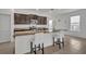 Modern kitchen with island and granite countertop, ideal for casual dining at 14325 Hidden Ct, Clermont, FL 34711