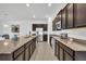 Spacious kitchen features stainless steel appliances, granite countertops, and ample cabinet space at 14325 Hidden Ct, Clermont, FL 34711