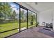 Screened in lanai, brick floor with views of large backyard, perfect for outdoor enjoyment at 14325 Hidden Ct, Clermont, FL 34711