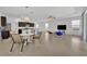 Bright, open living area flows into kitchen with modern appliances and casual dining space at 14325 Hidden Ct, Clermont, FL 34711