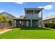 Spacious backyard featuring a covered patio and a lush green lawn, perfect for entertaining at 14525 Englert Aly, Orlando, FL 32827