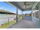 This large balcony features a ceiling fan and offers great views of the surrounding homes and foliage at 14525 Englert Aly, Orlando, FL 32827
