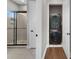 Modern bathroom with a glass-enclosed shower and a convenient stacked washer and dryer unit at 14525 Englert Aly, Orlando, FL 32827
