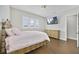 Comfortable bedroom features a bed, hardwood floors, windows and a dresser at 14525 Englert Aly, Orlando, FL 32827