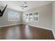 Bonus room featuring wood-look flooring and mounted television at 14525 Englert Aly, Orlando, FL 32827