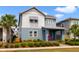 A charming two-story home with two tone exterior and meticulously landscaped front yard at 14525 Englert Aly, Orlando, FL 32827