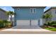 Contemporary two-story home with a two-car garage, lush landscaping, and modern architectural details at 14525 Englert Aly, Orlando, FL 32827