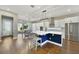 Bright kitchen showcases stainless steel appliances, an island with bar stool seating, and outdoor access at 14525 Englert Aly, Orlando, FL 32827