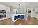 Modern kitchen with stainless steel appliances, sleek white cabinets, and a blue island at 14525 Englert Aly, Orlando, FL 32827