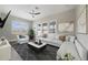 Bright living room with a modern design, featuring a large sectional sofa and stylish decor at 14525 Englert Aly, Orlando, FL 32827