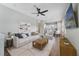 Open-concept living room with stylish furniture and a view of the modern kitchen at 14525 Englert Aly, Orlando, FL 32827