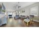 Open-concept living space showcasing the modern kitchen and comfortable seating area at 14525 Englert Aly, Orlando, FL 32827