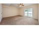 Bedroom with plush carpet, ceiling fan, and sliding glass doors to a pool at 1470 Winston Rd, Maitland, FL 32751
