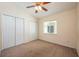 Comfortable bedroom with neutral carpet, ceiling fan, window, and ample closet space at 1470 Winston Rd, Maitland, FL 32751