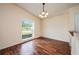 Dining room with hardwood floors and a large window offering neighborhood views at 1470 Winston Rd, Maitland, FL 32751
