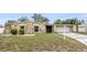 Charming single-story home featuring stone accents, an attached garage, and a well-manicured front yard at 1470 Winston Rd, Maitland, FL 32751