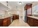 Open kitchen featuring granite countertops, stainless steel appliances, and tiled floor at 1470 Winston Rd, Maitland, FL 32751