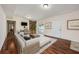 Inviting living room with hardwood floors, exposed brick, and a sliding door leading to the pool at 1470 Winston Rd, Maitland, FL 32751