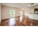 Bright living room featuring beautiful hardwood floors and oversized windows for natural light at 1470 Winston Rd, Maitland, FL 32751