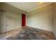 Mud room with tiled floors and vintage red door at 1470 Winston Rd, Maitland, FL 32751