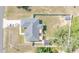 Home aerial view showing a long driveway and large backyard space with a shed at 15303 Sw 52Nd Cir, Ocala, FL 34473