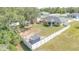 Aerial view of a fenced backyard with a shed, trampoline and plenty of space to play at 15303 Sw 52Nd Cir, Ocala, FL 34473