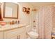 Bathroom with granite counters, a modern shower, and a stylish vanity at 15303 Sw 52Nd Cir, Ocala, FL 34473